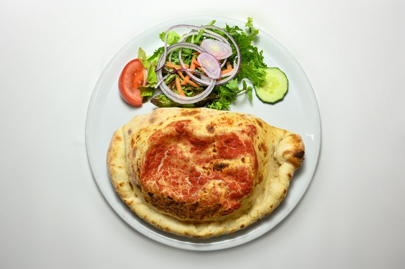 pizza lucs veggie calzone with pesto